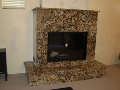Custom granite fireplace surround fabricated by Superior Granite and Marble