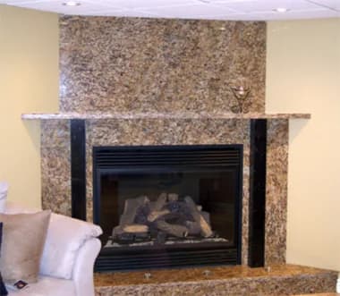 Granite and marble fireplace surround by Superior Granite and Marble
